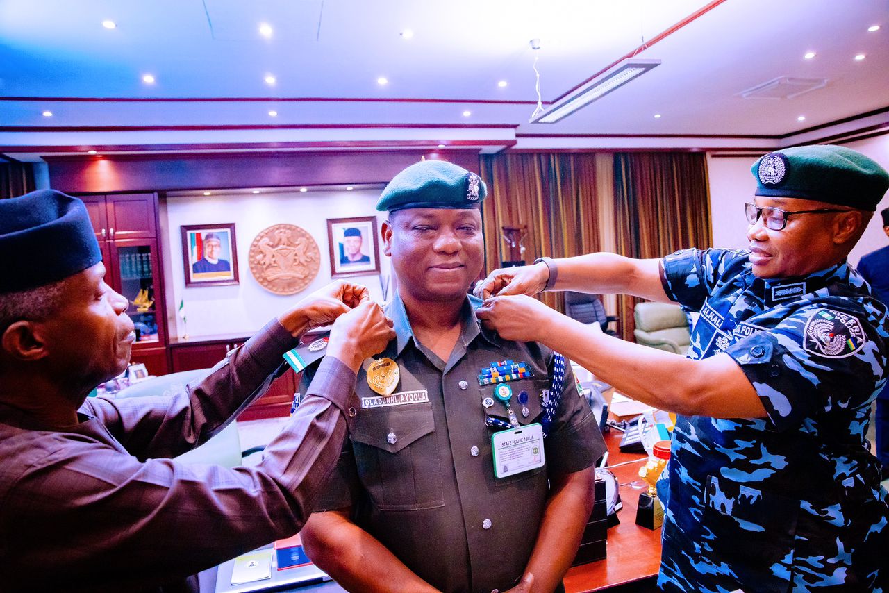 VP Osinbajo, Along With Inspector General Of Police, Usman Alkali, Decorate His Aide De Camp, Ayoola Oladunni With The Rank Of Assistant Commissioner Of Police At Statehouse On 09/06/2022